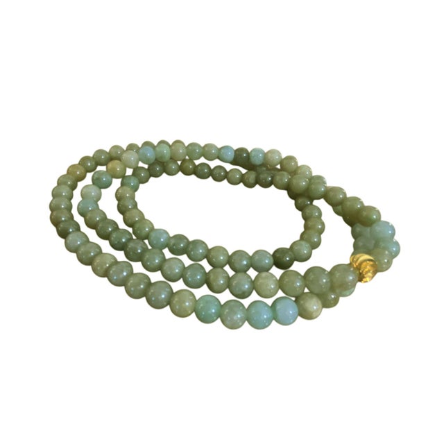 Superb elegant vintage hand sculpted Jadeite Jade Stone necklace with round beads and one gold tone bead 14" H Beads are...