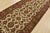 An authentic Agra runner hand-knotted with fine wool on a cotton foundation. This rug features a botanical design set...