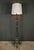 This wrought iron floor lamp, dating from the 1940s, is a true work of art, combining elegance and robustness. Made up of...