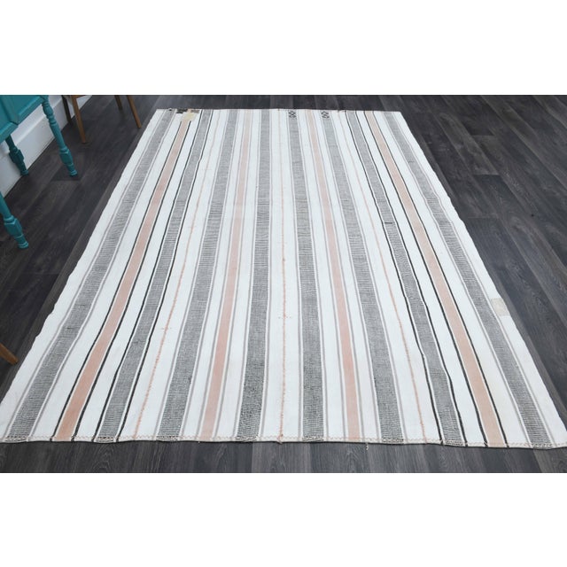 Vintage Hand-Knotted area rug is a semi-antique vintage area rug. The '70s Eastern region of Anatolia's unique rug is...