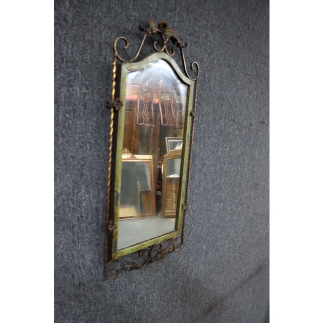 Oscar Bach style wall mirror in iron with tole gilded design.