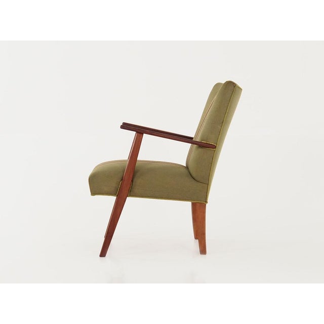 The armchair was made in the 1960s, Danish production. The structure and legs are made of solid teak. The armchair is...