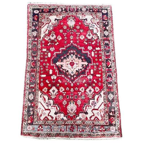 Vintage Tabriz rug made of wool on cotton, featuring a beautiful 1970s red base. Complementary colors include gray and...