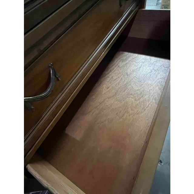 Mid-Century Vintage Five Drawer Dresser. Solid hardwood construction. Brass handles and accents. Easy-slide drawers....