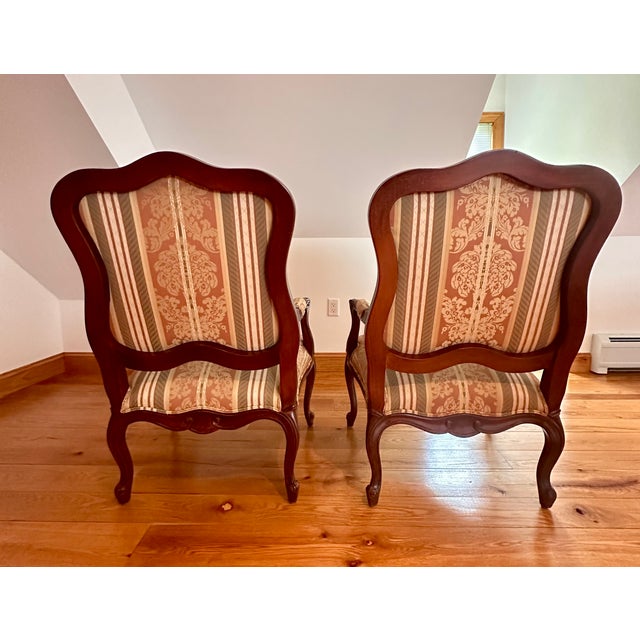 Elegant pair of Ethan Allen Avignon armchairs, model 13-7177, purchased new from Ethan Allen in 2003 and exceptionally...