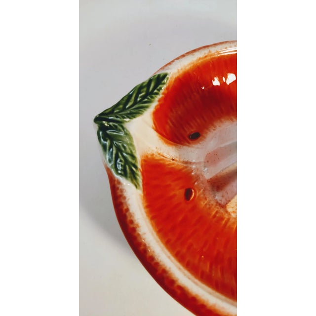 The ultimate kitchen accessory that brings a splash of Italian charm to your culinary space! This delightful orange juicer...