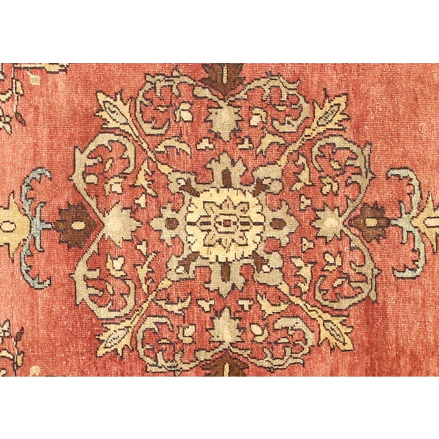 A vintage Turkish Oushak measuring 4'8" x 12'4", hand-woven with wool on wool foundation. This piece displays the region's...
