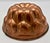 A handsome 19th-century French culinary mould crafted from solid copper, with a deeply modeled lobed form and original...