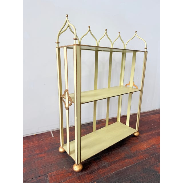 A refined, architecturally styled three-tier étagère in painted tole/metalwork, produced in Mexico for Brugar Design, New...