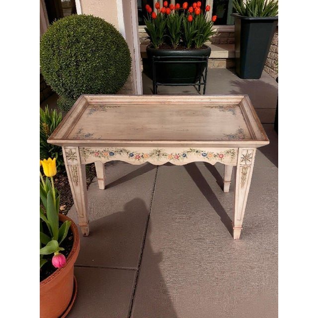 This Vintage Italian Hand Painted Floral Garland Distressed Side Center Tray Table is a beautiful and unique piece that...