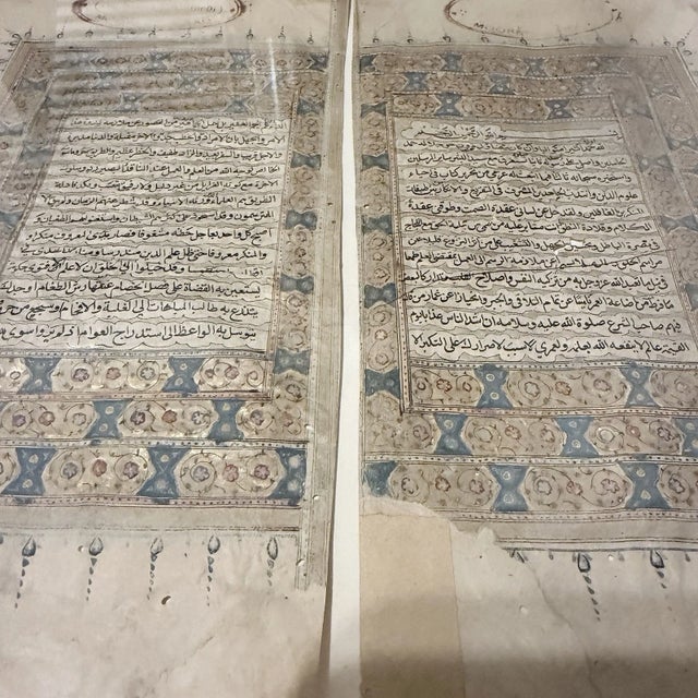 Presenting a rare and visually striking pair of illuminated Arabic manuscript leaves, dating to the 18th/19th century....
