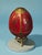 The Franklin Mint House of Faberge Imperial Porcelain Red Gilded Jeweled Egg is a stunning decorative collectible piece...