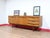 This Mid Century Modern Vintage Teak Sideboard Credenza in the style of Stonehill is a fabulous example of a mid century...