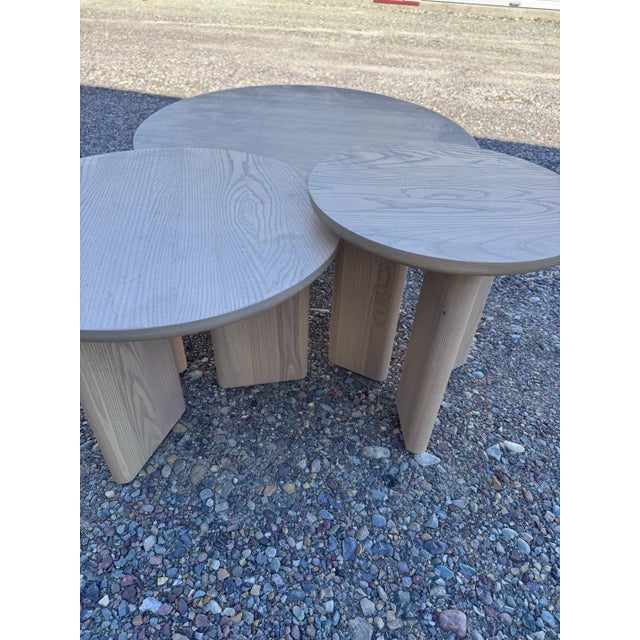 Driftwood ash finish nesting coffee table set. Can be used all together or separate. Dimensions Overall 18" Diameter...