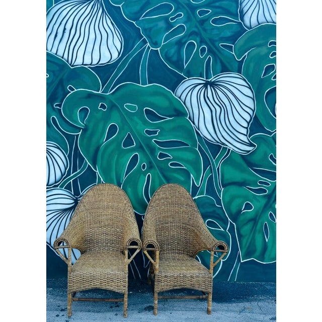 This exceptional pair of early 20th - Century period handmade wicker & rattan chairs are a rare find truly showcasing the...