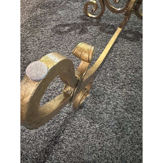Beautiful very large gilt wrought iron Hollywood Regency cocktail table. Styled after Gilbert Poillerat. This elegant long...