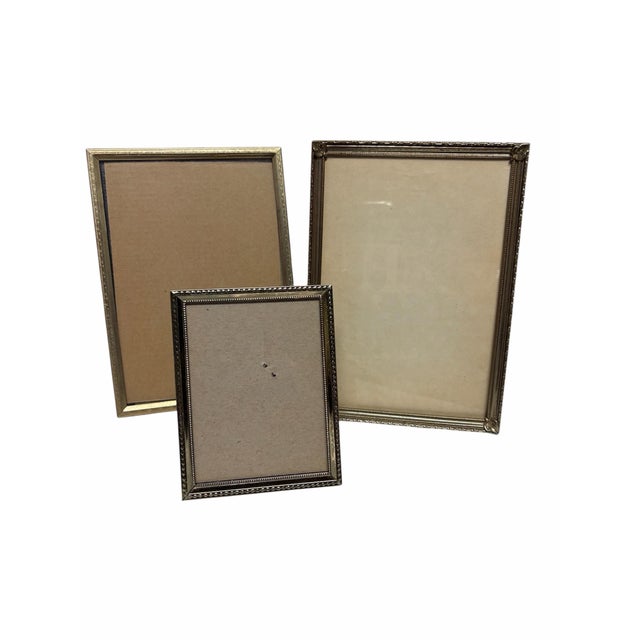 Three Thin Brass frames with etched patterns on outer frame, two 4.5x6,5 One is 2.75 x3.75 textured easel back and Velvet...