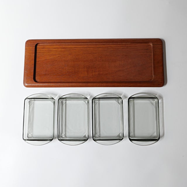 Set with 1 teak tray and 4 glass pieces. This piece has an attribution mark, I am sure that it is completely authentic and...