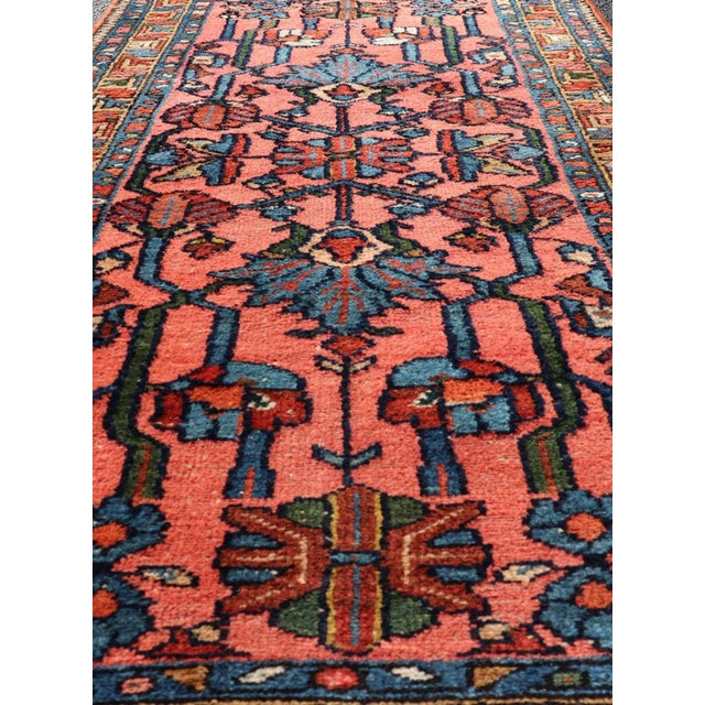 Antique Persian Lilihan rug in all-over design in jewel tones and pink field. Keivan Woven Arts / rug/ X23-0110, Antique...