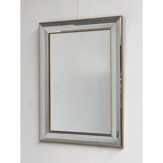 A striking vintage wall mirror by belgian mirror manufacturer deknudt, dating from the 1970s. This glamorous design...