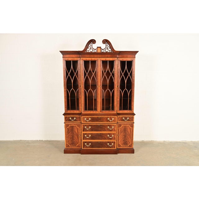 A gorgeous Georgian or Chippendale style lighted breakfront bookcase or dining cabinet By Councill Craftsmen USA, Circa...