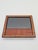 An elegant, small vintage frame made of wood veneered with a decorative veneer featuring a beautiful, natural grain in...