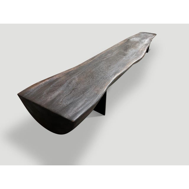 A beautiful suar wood reclaimed log has been cut in half to produce this dramatic long bench with a live edge from 22” to...