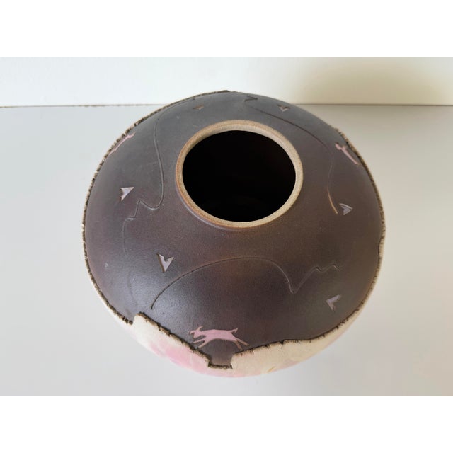 Beautiful 1992 Native American studio pottery vase featuring a distinctive rounded form with a wide mouth, hand-carved...