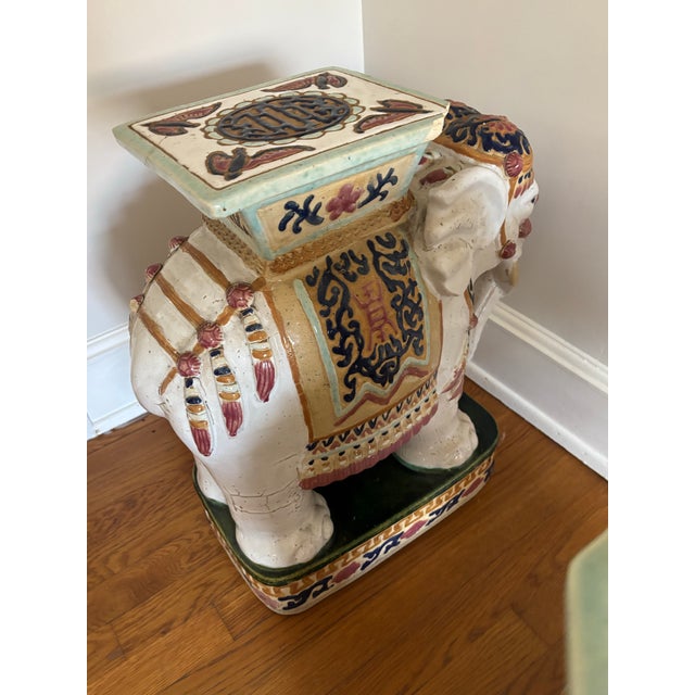 Great pair of vintage decorative elephant garden seats. Each are adorned with various decorations in soft colors. These...