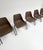 Brown and black set of 6 Polyprop chairs on a metal frame. The Polyprop chair was designed in 1963 by Robin Day for Hille....