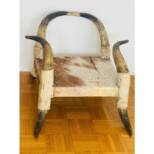 Unique antique Texas horn chair with cowhide upholstery low chair. Great decorative piece.
