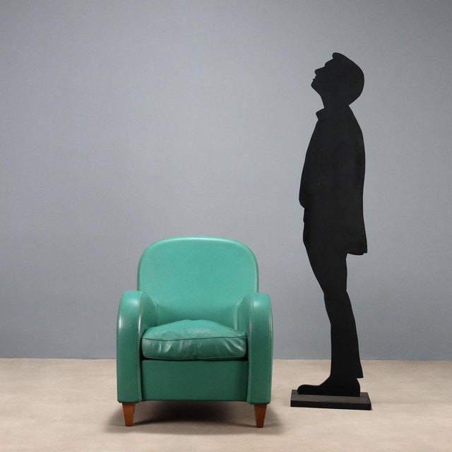 Armchair with foam padding and feather seat, leather upholstery. This piece is attributed to the mentioned designer/maker....