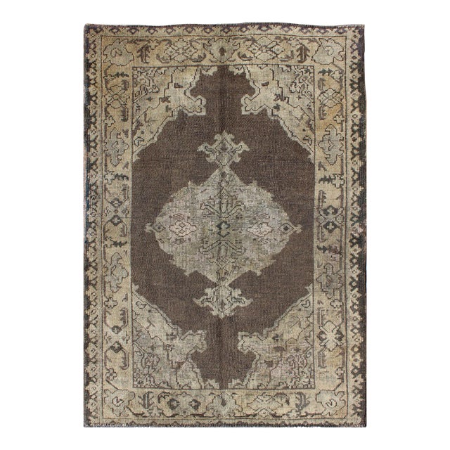 Chocolate Background Vintage Turkish Oushak Rug With Floral Medallion in Cream For Sale