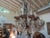 Unusual French Maison Baguès attributed Louis XVI style bronze and wood beaded and crystal chandelier. This stunning...