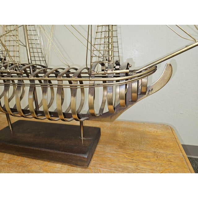 Large-scale brass sailing ship free standing sculpture, executed in a dramatic, dimensional composition and signed “C....