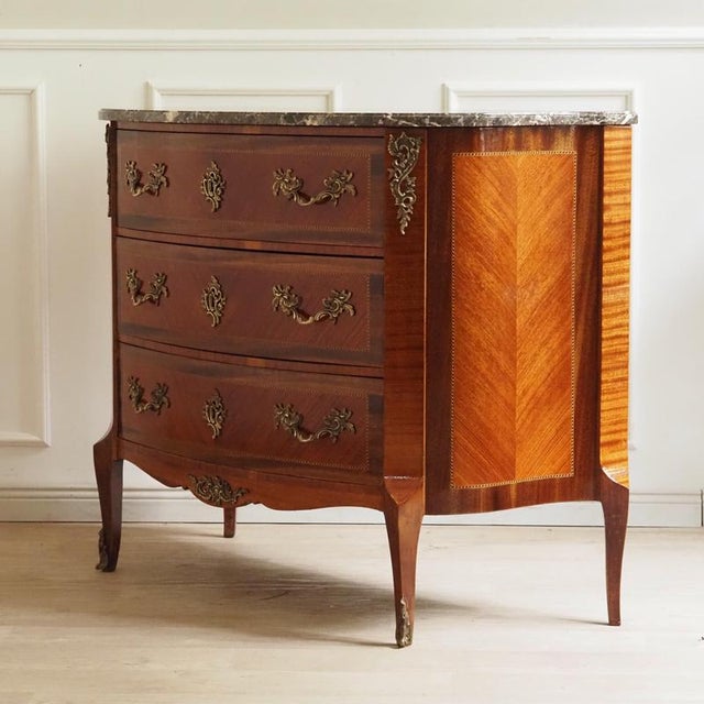 An elegant three-drawer chest from france in the louis xv style, dating from the second half of the 19th century, when...