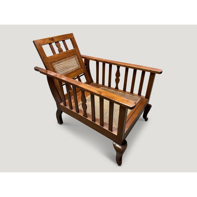 Beautiful Dutch colonial teak chair with adjustable back rest. Pair available. The price reflects one. Circa 1950. Full...