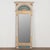 19th-century Swedish trumeau mirror crafted in wood with a gold gilt finish set against a gray and blue painted...