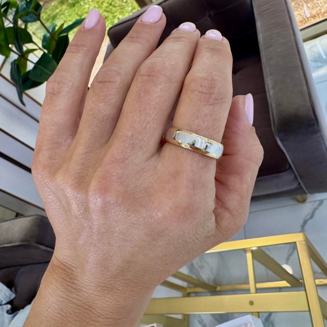 Gender: Men Metal Type: Platinum and 18K Yellow Gold Ring Size: 9 Width: 5.75 mm Weight: 10.05 grams One man's 900...