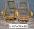 An elegant pair of swivel rattan armchairs, dating from the 1970s, with a design typical of the vintage and bohemian...