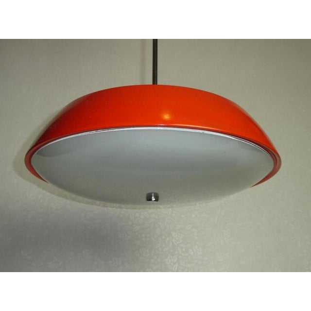 Red hanging lamp model 1117 by Josef Hurka for Napako. This piece is attributed to the mentioned designer/maker. It has no...