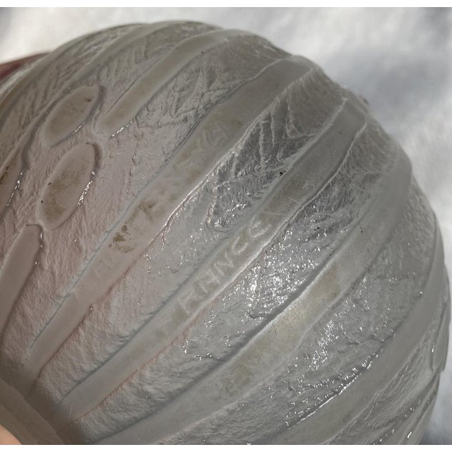 Elegant Art Deco lamp base in molded and acid-etched glass, signed Daum Nancy France. The spherical shape (13 cm) is...