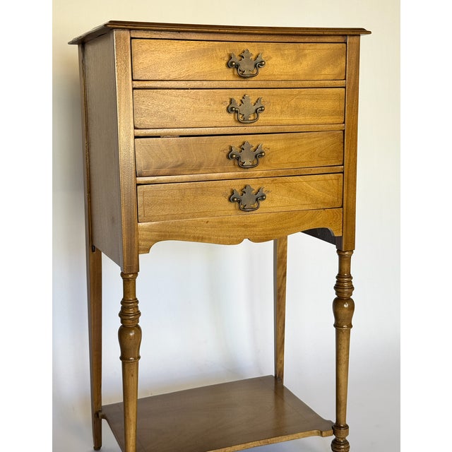 Great antique entry cabinet with wonderful details. Delicate wooden inlay throughout the frame, and detailed turned legs....