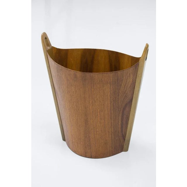 Wastepaper bin designed by einar barnes. Produced in norway by ps heggen during the 1950s. Made from laminated teak and...