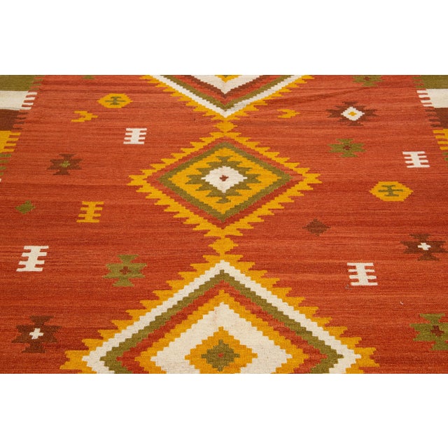 Beautiful Modern Kilim hand-knotted wool rug with a multicolor accents in an all-over geometric design. This rug measures:...