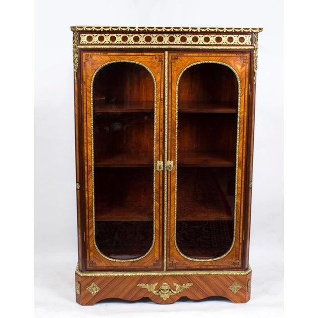 This is a fabulous Victorian burr walnut and double door display cabinet, Circa 1860 in date. It has been accomplished in...