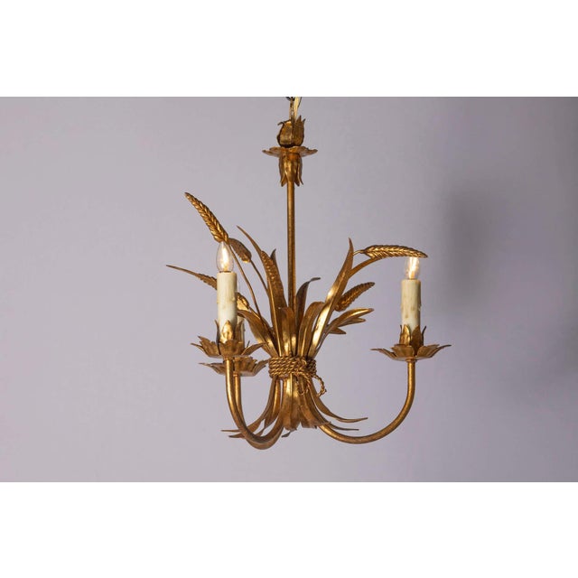 This 20th-century French chandelier embodies elegance inspired by Coco Chanel’s signature aesthetic, blending luxury with...