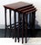 An elegant Art Nouveau side table set comprising four individual tables of varying sizes that can be nested inside one...