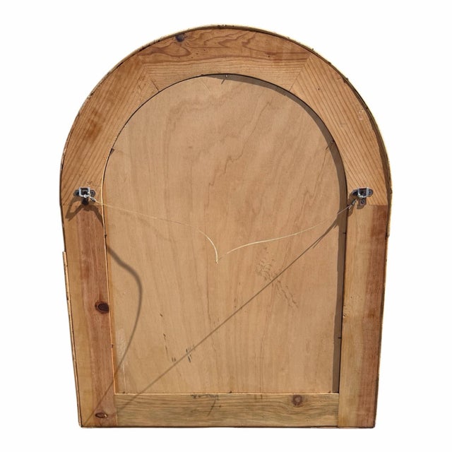 Vintage large pencil Reed mirror with arched shape.