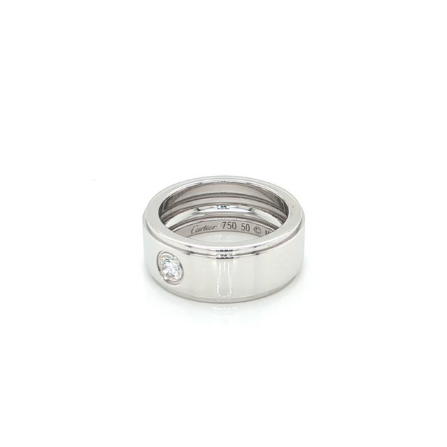Experience timeless elegance with this authentic Cartier wedding band. Crafted in lustrous 18k white gold, the ring...